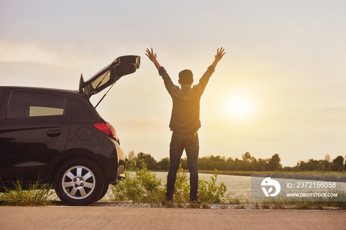 Man at car on road enjoying landscape nature