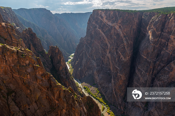 Steep granite cliffs of the Black Canyon of the Gunnison with the two dragons and the mysterious Gun