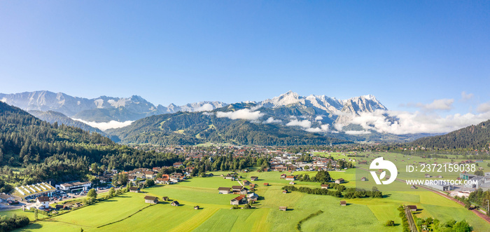 Aerial panorama view of Garmisch Partenkirchen Village with view of Zugspitze in fog