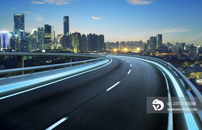 Highway overpass motion blur with city background .