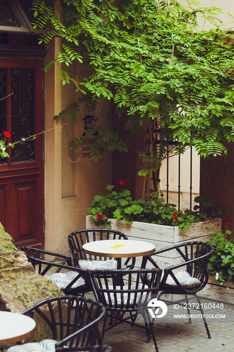 Cozy tables with chairs in the old city cafe