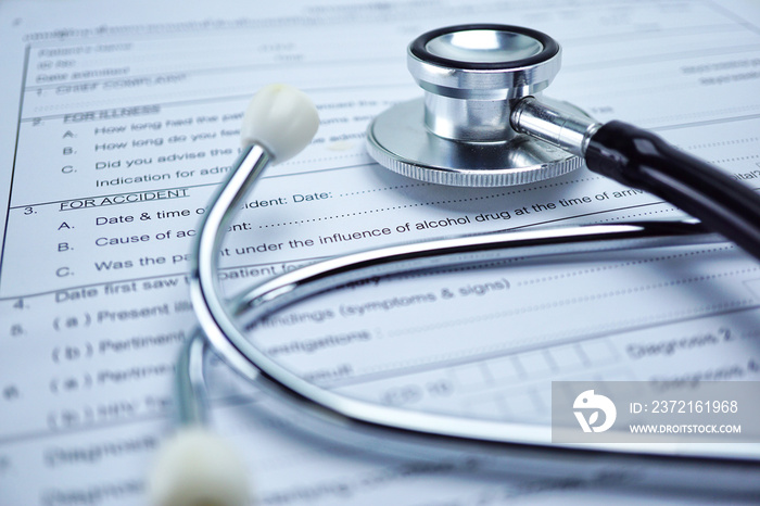 Health insurance accident claim form with stethoscope, Medical concept.