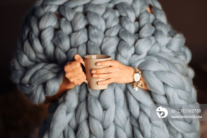 blue knitted blanket with cup