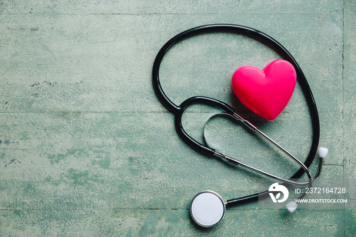 World health day,red heart and stethoscope on old wood table, copy space background for text,medical