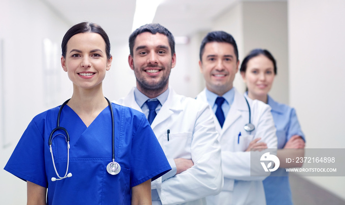 group of happy medics or doctors at hospital