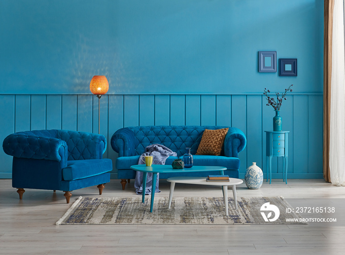 Blue sitting sofa and furniture, home decoration, orange lamp and carpet decoration.