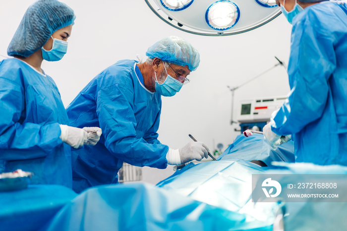 Professional anesthesiologist doctor medical team and assistant preparing patient to gynecological s