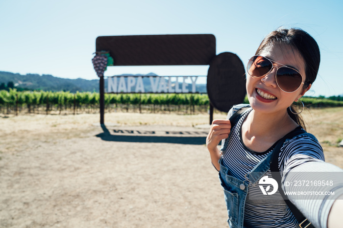 asian woman taking selfie with the vineyard