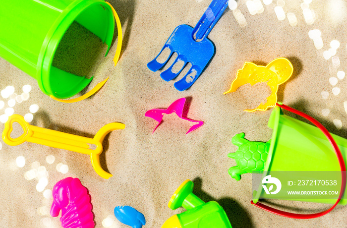 childhood and summer concept - close up of sand toys kit on beach