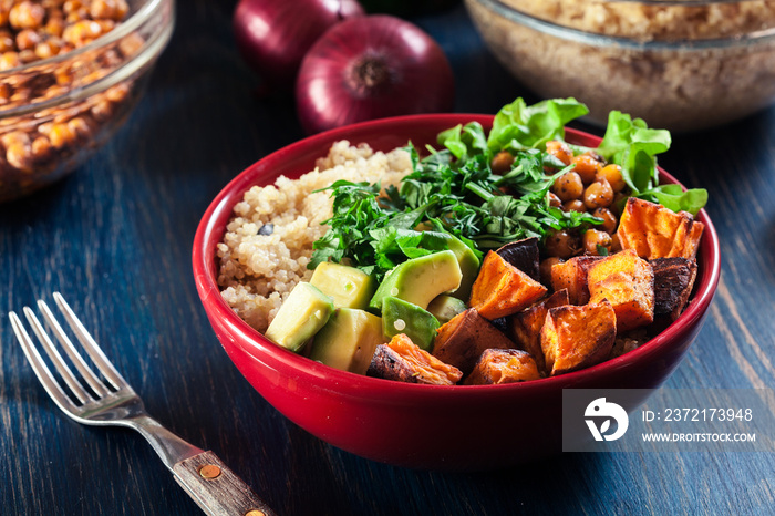 Colorful buddha bowl with quinoa and roasted and fresh vegetables