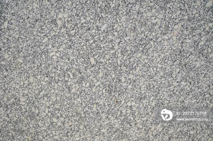 Stone structure of a stone slab, cut and processed from natural stone, photographed in daylight 