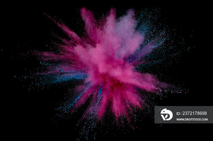 Colored powder explosion. Abstract closeup dust on backdrop. Colorful explode. Paint holi