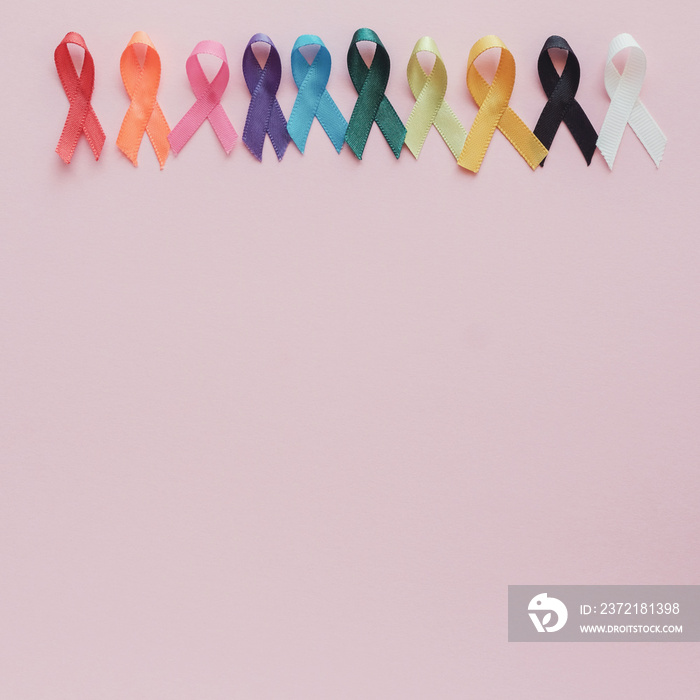 colorful ribbons on pink background, cancer awareness, World cancer day