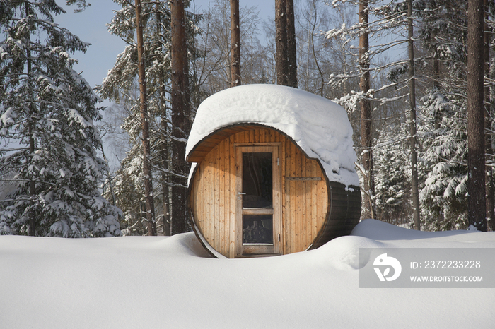 Round Barrel Sauna in the Snow