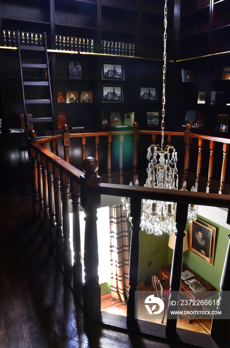 Railing and chandelier in traditional home