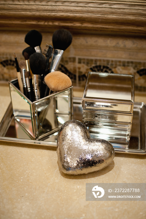 Close-up of make-up brushes on table