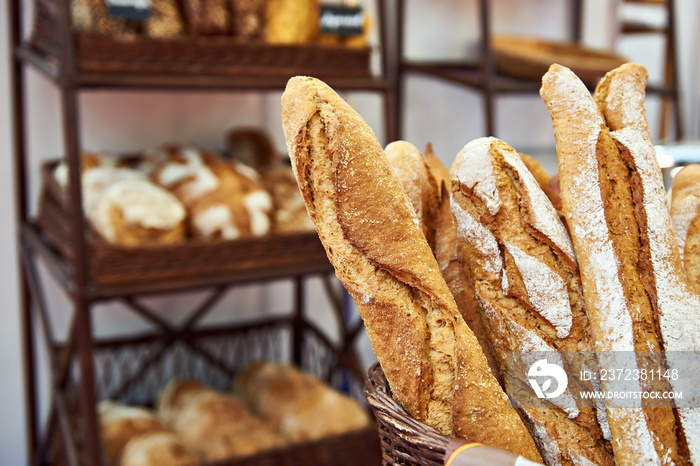 Bread baguettes in basket at baking shop