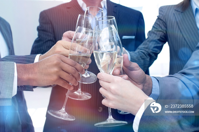 Close up of business team toasting with Champagne