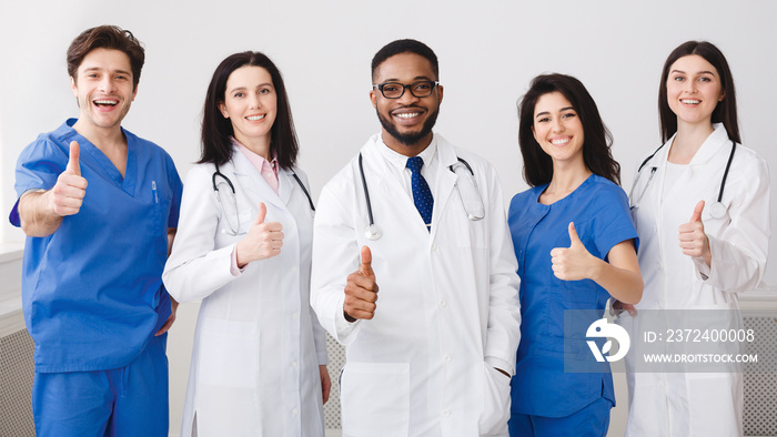 Happy Medical Team Showing Thumbs Up, Standing In Row