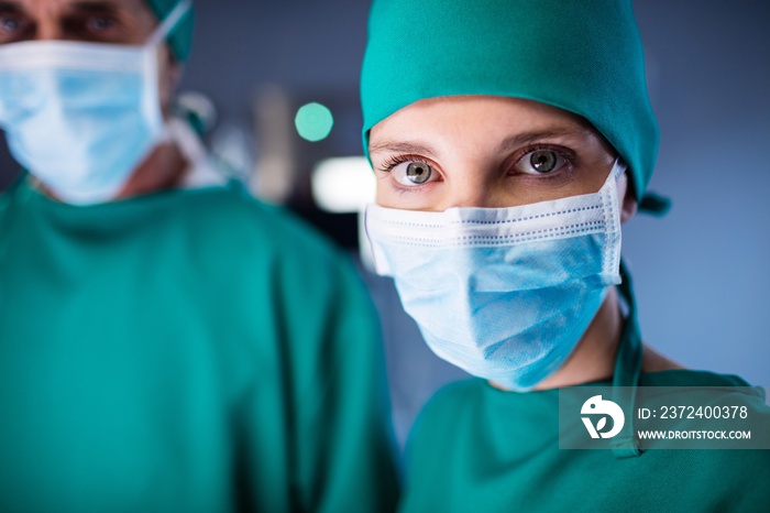 Portrait of female surgeon standing in a operating room