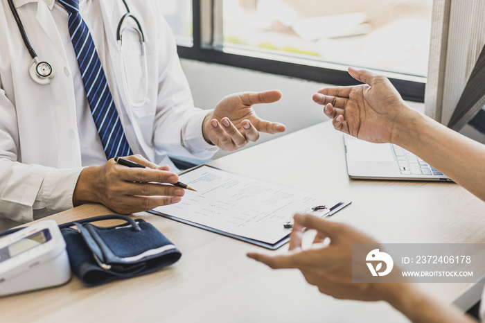 Doctors and patients are talking in the examination room of a private hospital, they are discussing 