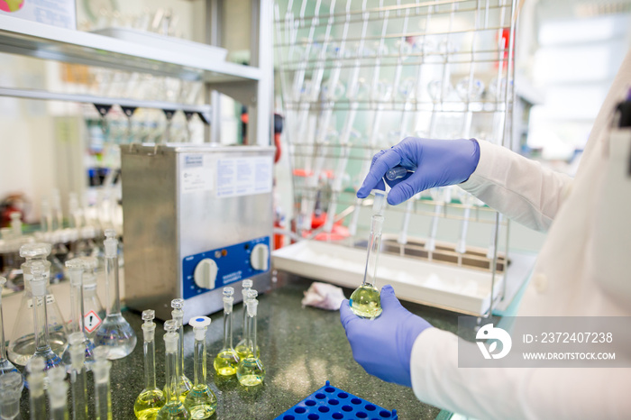 Flasks with liquids in a lab, pharmaceutical industry factory and production laboratory, chemistry c