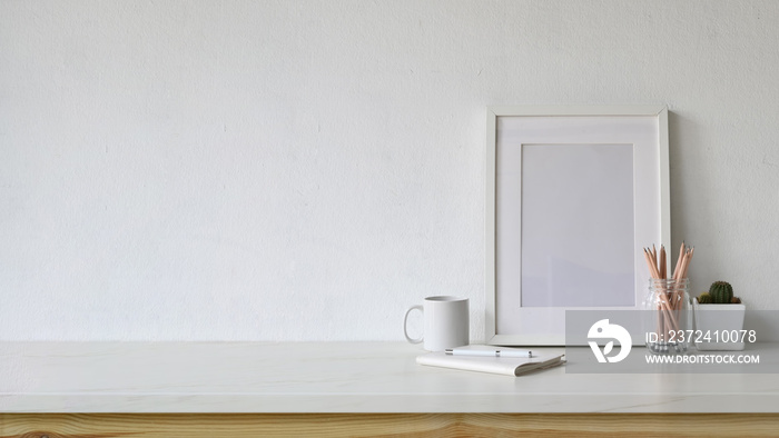 White workspace empty poster and copy space with home office supplies.