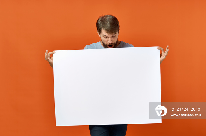 man holding a blank board