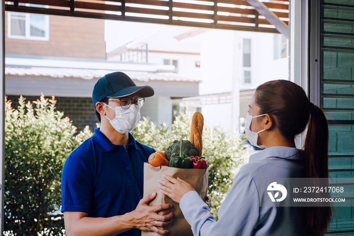 Delivery of asian man wearing a protective mask during an epidemic virus while he was delivering a b