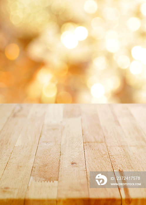 Wood table top on shiny bokeh gold background
