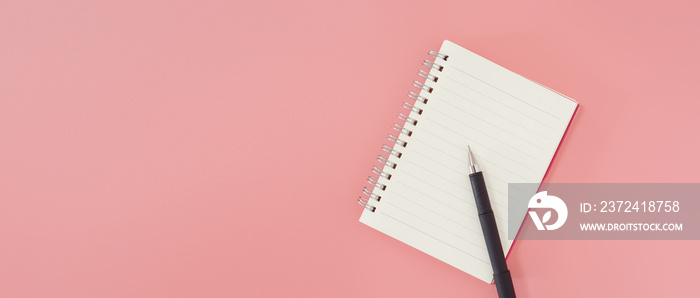 Empty notebook and pen for to do list on pink background, workspace for text top view.