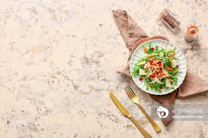 Plate with tasty arugula salad on grunge background