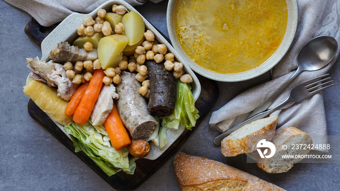 Cocido, traditional chickpea-based stew from Madrid.  on the grey stone background