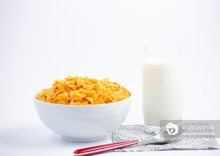 Natural corn flake breakfast cereal in cups and milk is a healthy breakfast that is good for your bo