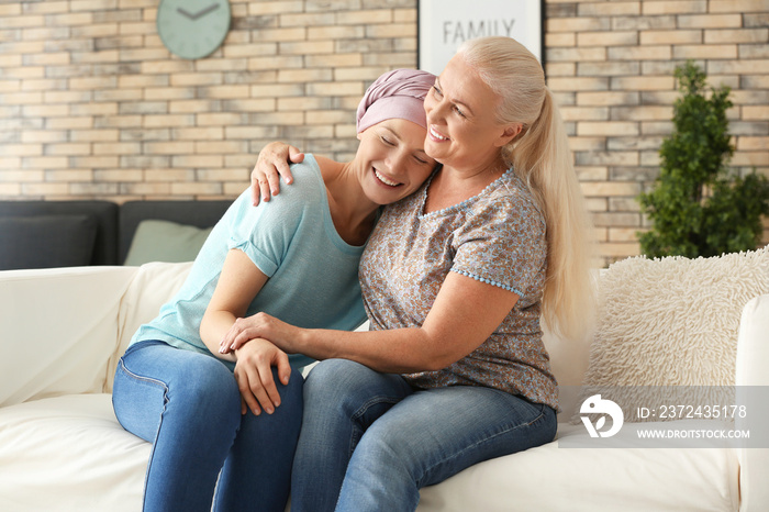 Mother with her daughter after chemotherapy at home