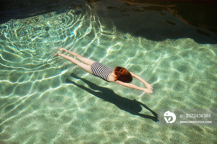 Girl swimming in pool