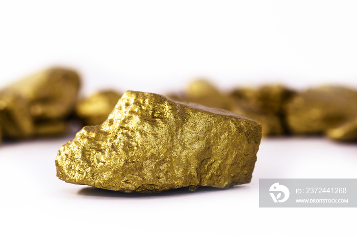 Gold stone in high resolution. Gold on white background isolated. Mineral extraction concept.