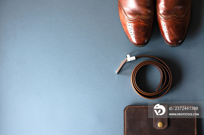 Flat lay with mens accessories on a gray stylish background.