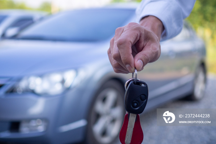 The owner or sales representative is sending the rental car keys to the buyer or the renter. Concept