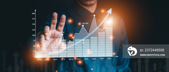 Businessman hand show Stock chart showing rising stock sign with graph indicator. Interest rate fina