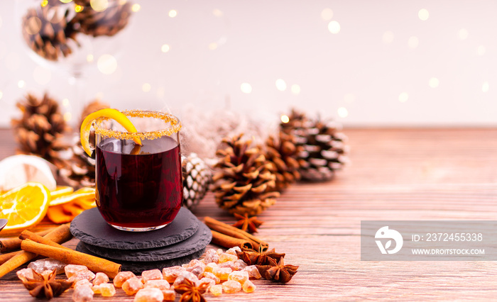 Gluhwein sweet hot warm Mulled red Wine or punch tea in mug cup glass spices citrus aromatic cinnamo