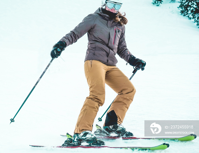 Young athlete skiing on snow high  mountains