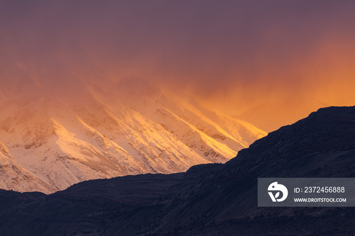 Sunrise over snow covered mountains in Patagonia, Chile