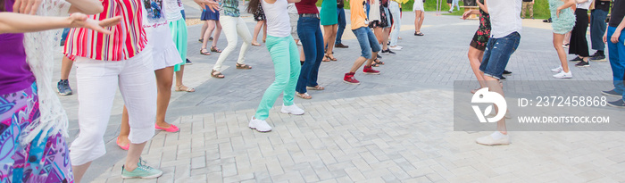 Social dance and flashmob concept - Fun and dance with in the summer on a city street. Close-up of d