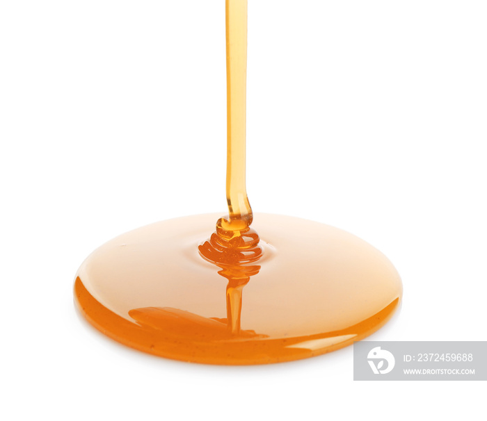 Sweet honey pouring on white background