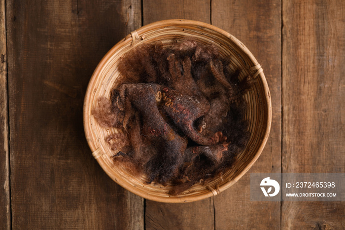 Newborn photography digital background prop. Wood basket with brown fur and on a wooden background