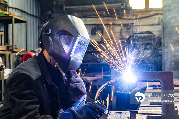 Welding work in an electromechanical workshop at a mechanical assembly site.