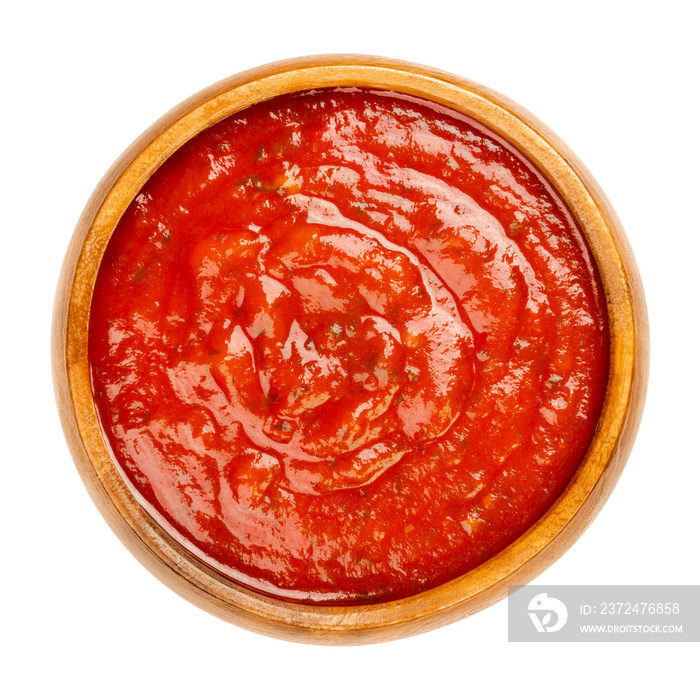 Arrabbiata sauce in a wooden bowl. Spicy Italian tomato sauce for pasta, made from tomatoes, garlic 