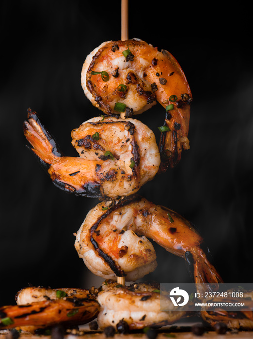 Skewer shrimps burnt grilled with spice seasoning.