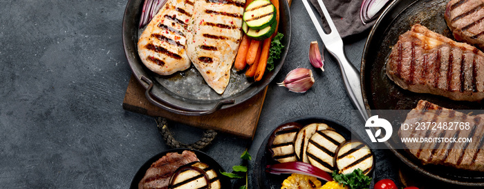 Grilled barbecue meat assortment on dark background.